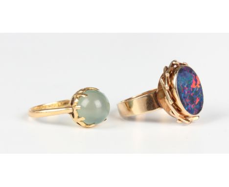 A gold ring, collet set with an oval opal doublet, detailed '9c', weight 4.7g, ring size approx O, and another gold ring, mou