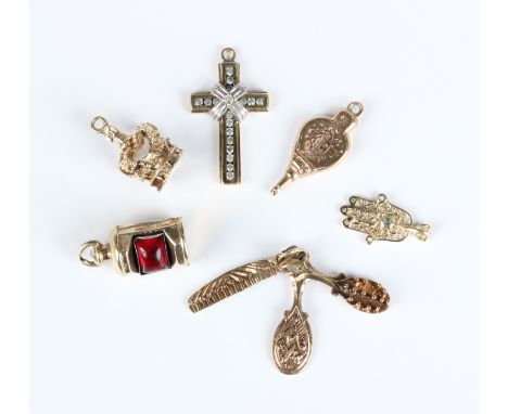 A gold and diamond pendant cross, unmarked, weight 2.2g, length 2.5cm, four further 9ct gold pendants, comprising a crown, a 