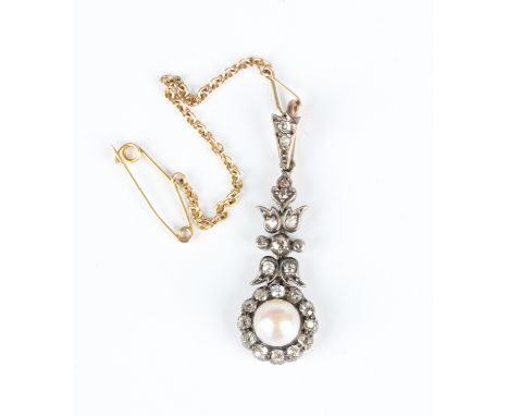 A gold and silver set, diamond and pearl pendant in a foliate drop shaped design, mounted with old mine and rose cut diamonds