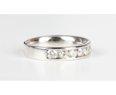 An 18ct white gold and diamond half eternity ring, channel set with circular cut diamonds, weight 4.1g, ring size approx L1/2