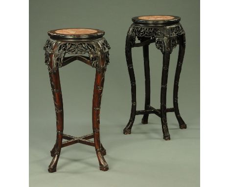 A pair of 19th century Chinese hardwood jardiniere stands, each with rouge marble top.  Diameter 39 cm, height 92 cm.  CONDIT