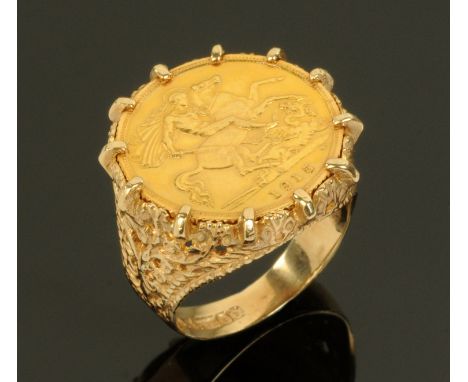 A George V half sovereign, 1915s, within a 9 ct gold ring mount, with foliate pierced shank, gross weight 9.3 grams. CONDITIO