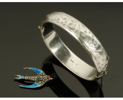 A sterling silver enamel and marcasite set swallow brooch, and a silver hinged hollow bangle, Charles Horner, Chester 1959.