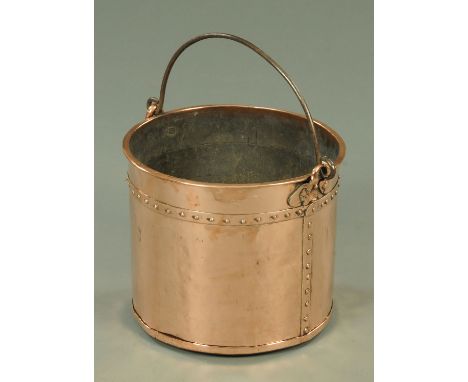 A Victorian copper coal receiver, with wrought iron bale handle, the cylindrical body with rivet type decoration, height 29.5
