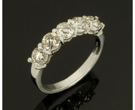 An 18 ct white gold five stone half eternity ring, set with diamonds weighing +/- 1.53 carats, size M.   CONDITION REPORT: Th