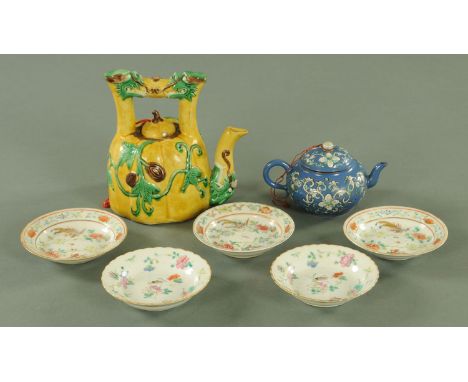 A Chinese egg and spinach glaze melon form teapot, 19th century, with dragon mask handle, the body with leaf moulded fruiting