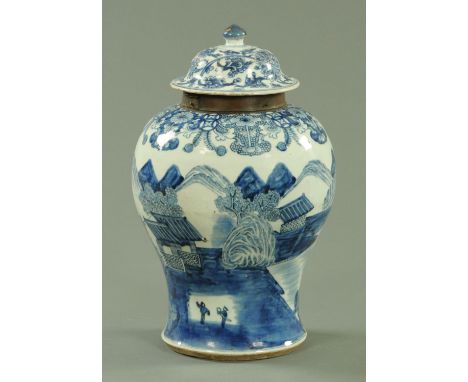 A Chinese blue and white inverted baluster vase and cover, Qianlong period, the cover with lotus flower and scroll decoration