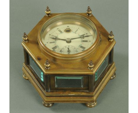 A brass cased table clock, early 20th century, the enamel dial with Roman and Arabic numerals, subsidiary seconds dial and ha