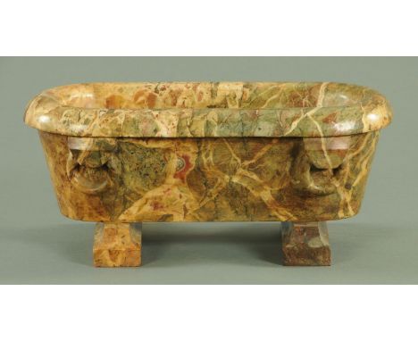 A Grand Tour style variegated marble model of a Roman bath, 19th century, the carved roll top and loop form handles upon shap