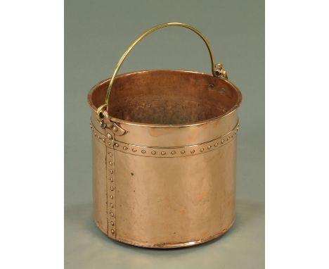 A 19th century copper coal receiver, with brass bale handle, the cylindrical body with rivet type decoration, height excludin