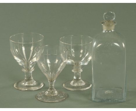 A Georgian glass square decanter, and three early 19th century glass rummers. CONDITION REPORT: The decanter stopper has a ma