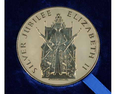 A Queen Elizabeth II Silver Jubilee Platinum medallion, 1977, Obv: Portrait of the Queen, seated facing on a throne holding a