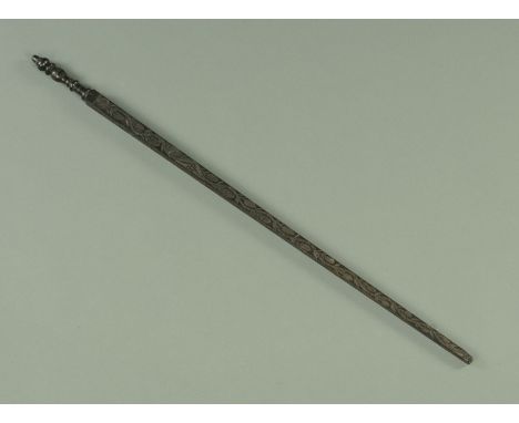 A late 17th century Dutch carved and turned ebony double Ell, having a well turned handle with acorn finial above a tapering 