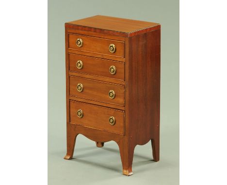 A George III style mahogany chest of drawers, with caddy top above four graduated drawers with brass drop handles with circul