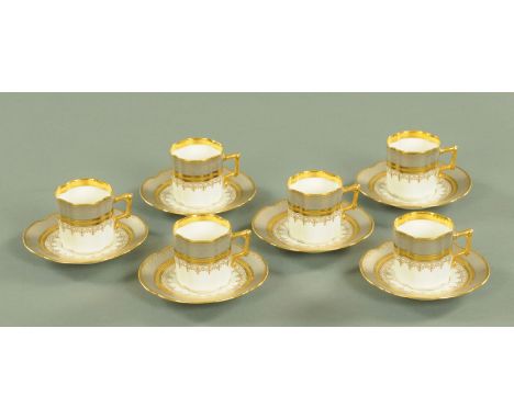 Six Continental porcelain coffee cups and saucers, with grey banding and gilt rims.   CONDITION REPORT: All coffee cans and s