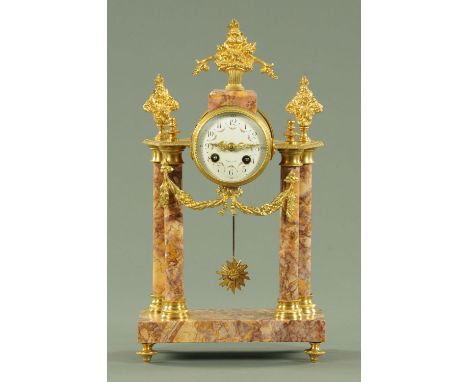 A Continental marble and brass mantle clock, with two-train movement striking on a bell.  Height 40 cm, width 22.5 cm.  
