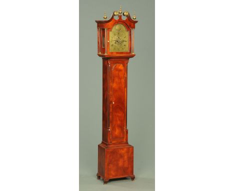 An Edwardian mahogany longcase clock, with swans neck pediment and arched glazed door enclosing the brass dial and two-train 
