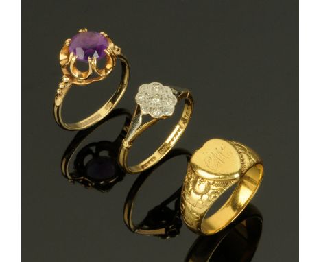 An 18 ct gold and platinum ring, cluster with small diamonds, a 9 ct gold ring with amethyst coloured stone and heavy gold co