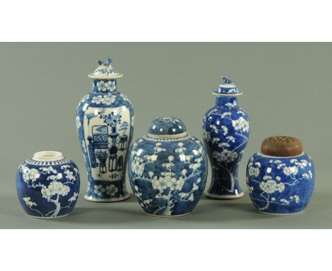 Chinese blue and white, 19th century, comprising two vases and covers, one vase decorated with precious objects, three ginger