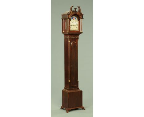 An Edwardian mahogany grandmother clock, with swans neck pediment with fretwork panels beneath, the silvered dial with Roman 