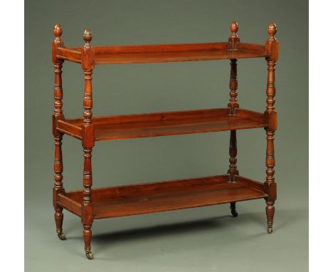 A Victorian mahogany dumbwaiter, rectangular, three tier and raised on turned legs with brass castors.  Width 120 cm.  CONDIT