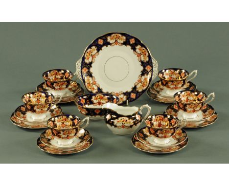 A Royal Albert tea set, six cups, six saucers, six plates, sandwich plate, sugar basin and milk jug.  