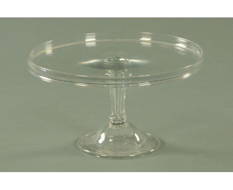 A Georgian glass tazza, late 18th/early 19th century, circular top with raised rim upon an inverted slightly wrythen tapering