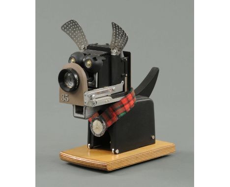 A steam punk inspired Scottie dog "Benzi", manufactured from a Minolta mini 35 projector and stainless steel colander etc, al