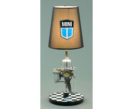 A Steam Punk inspired table lamp, formed from a Mini carburettor, with Mini branded light shade and base, height 70 cm (see i