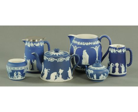 Five pieces of Wedgwood Jasperware, early 20th century, comprising a large water jug, two hot water jugs, sucrier and sugar b