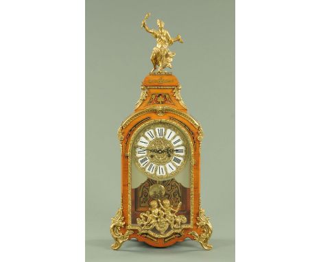 A French style faux boulle marquetry mantle clock, with brass mounts and with two-train movement striking on a bell.  Height 