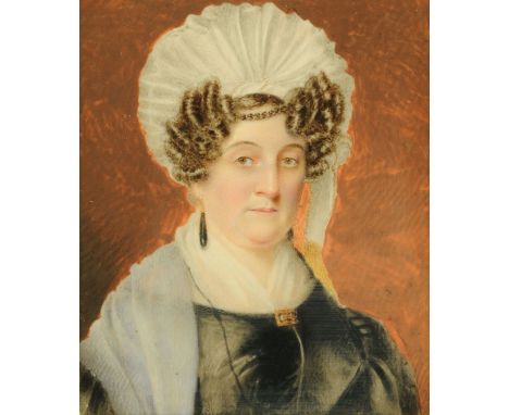 A 19th century portrait miniature on ivory, lady wearing a bonnet and with tightly curled hair, 8.5 cm x 7 cm, framed. CONDIT