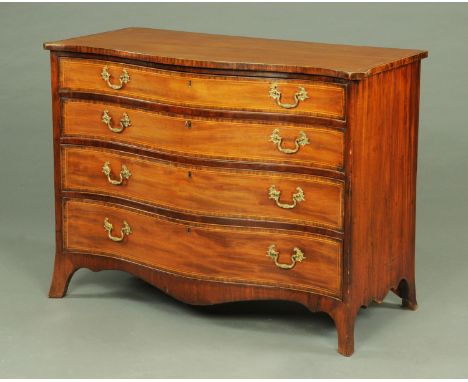 A George III mahogany serpentine fronted chest of drawers, being rosewood banded, the four long graduated drawers with brass 