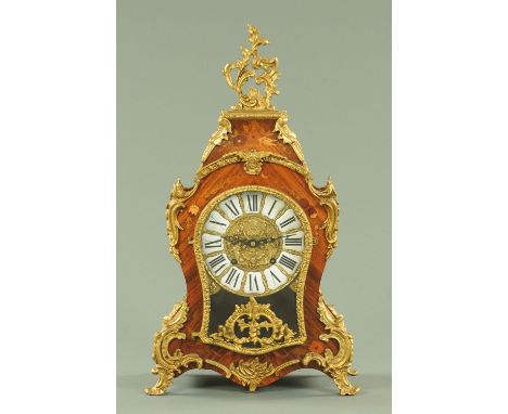 A French style foliate marquetry mantle clock, with brass mounts and two-train spring driven movement striking on a bell.  He