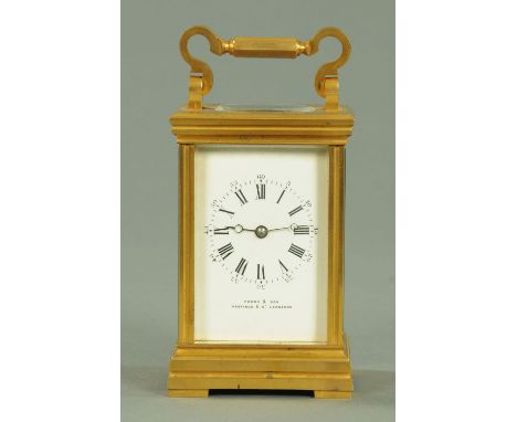 A French brass cased carriage clock, late 19th century, having an enamelled dial with Roman and Arabic numerals, retailed by 