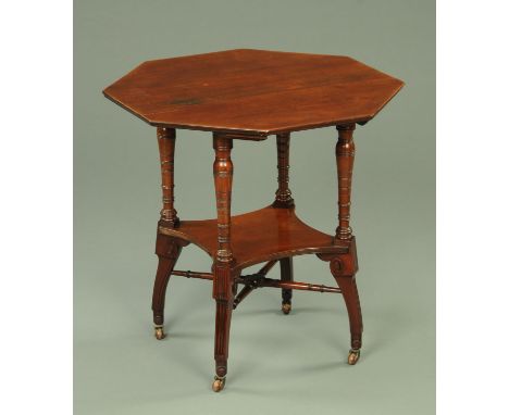 A late 19th century Aesthetic Movement octagonal occasional table, raised on four turned supports with shelf and cross stretc