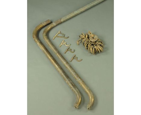 A large Victorian brass bay window curtain pole, complete with rings.  Length of centre section 350 cm, each side section +/-