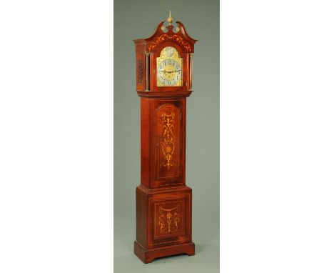 An Edwardian inlaid mahogany longcase clock, with swans neck pediment above the arched silvered brass dial with three- train 