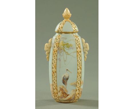 A Royal Worcester porcelain pot pourri vase and cover, date code for 1912, cylindrical form, with four pierced foliate scroll