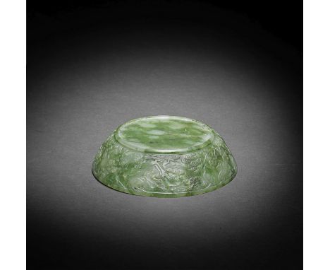 A SPINACH-GREEN JADE COVER18th/19th centuryExpertly carved around the exterior in low relief with a continuous scene of crane