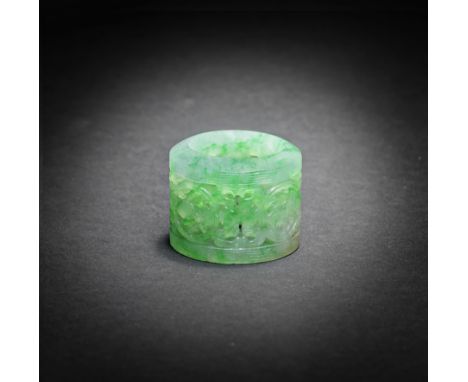 A VERY FINE AND RARE JADEITE RETICULATED THUMB RING19th centuryOf cylindrical form with the top rim of rounded slanted form a