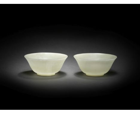 A PAIR OF PALE GREEN JADE BOWLS18th centuryEach carved with deep rounded sides rising from a crisply-cut foot ring to a gentl