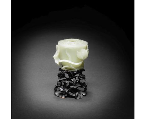 A PALE GREEN JADE 'LOTUS POD' WATER POT18th centuryFinely hollowed in the form of an open lotus pod with lotus seeds around t