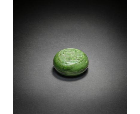 A SPINACH-GREEN JADE CIRCULAR BOX AND COVERQianlongThe box with gently rounded sides, set on a crisply carved foot, the round