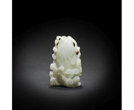 A VERY PALE GREEN JADE 'LEAPING CARP' VASEQianlongCrisply carved as a mythical fish with whiskers and incised scales leaping 