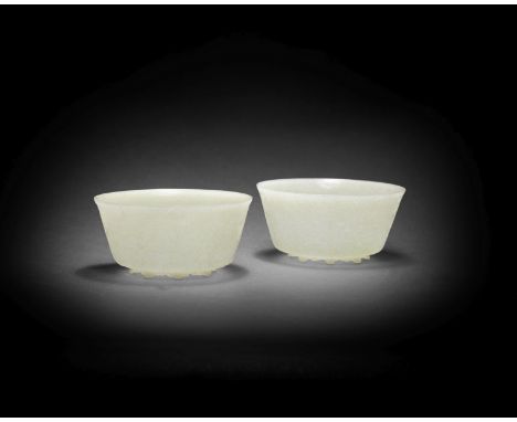 A FINE PAIR OF MUGHAL PALE GREEN JADE BOWLSIndia 18th/early 19th centuryBoth elegantly modelled with steep and gently flaring