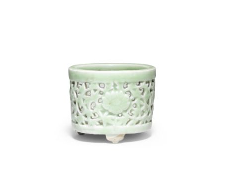 A CELADON-GLAZED RETICULATED 'FLORAL' TRIPOD INCENSE BURNER18th/19th centuryOf cylindrical form raised on three bracket feet,