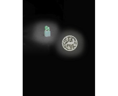 A SMALL JADEITE 'BUDDHIST LION' SEAL AND A WHITE JADE OPENWORK PENDANTThe seal 19th/early 20th century; the pendant 19th cent