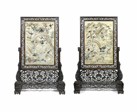 A VERY LARGE PAIR OF EMBROIDERED SILK 'HUNDRED BIRDS' PANELS INSET INTO HONGMU SCREENS19th centuryThe panels finely embroider
