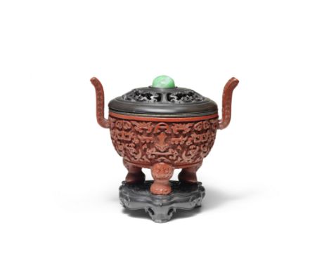 A RARE CINNABAR LACQUER CARVED TRIPOD INCENSE BURNER, DINGQianlongOf archaistic form, carved around the exterior with taotie 